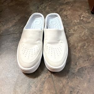 Brand new. Never worn Nike slip on tennis shoes